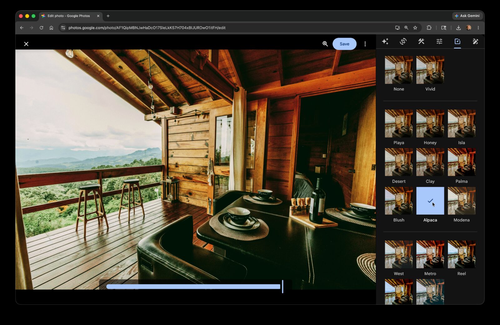 Google Photos editor on a cabin balcony shot with the filter panel open and the Alpaca preset selected.